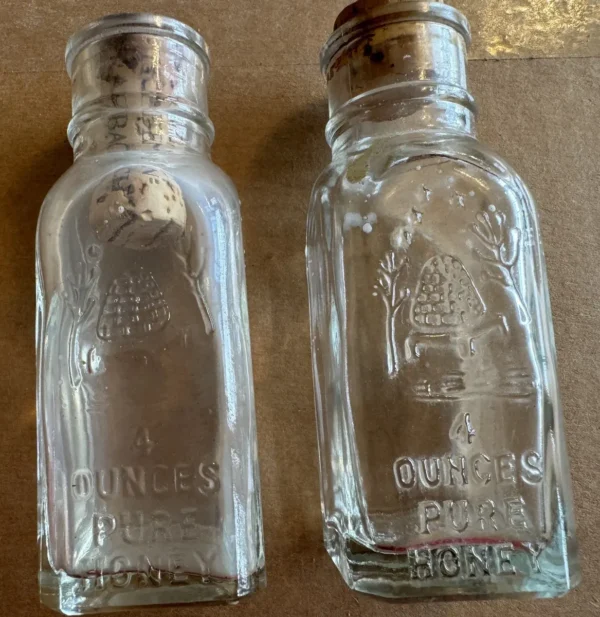Two 4-ounce Vintage Honey Acres Pure Honey glass bottles w/corks